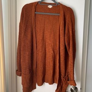 Comfy rust colored sweater with pockets